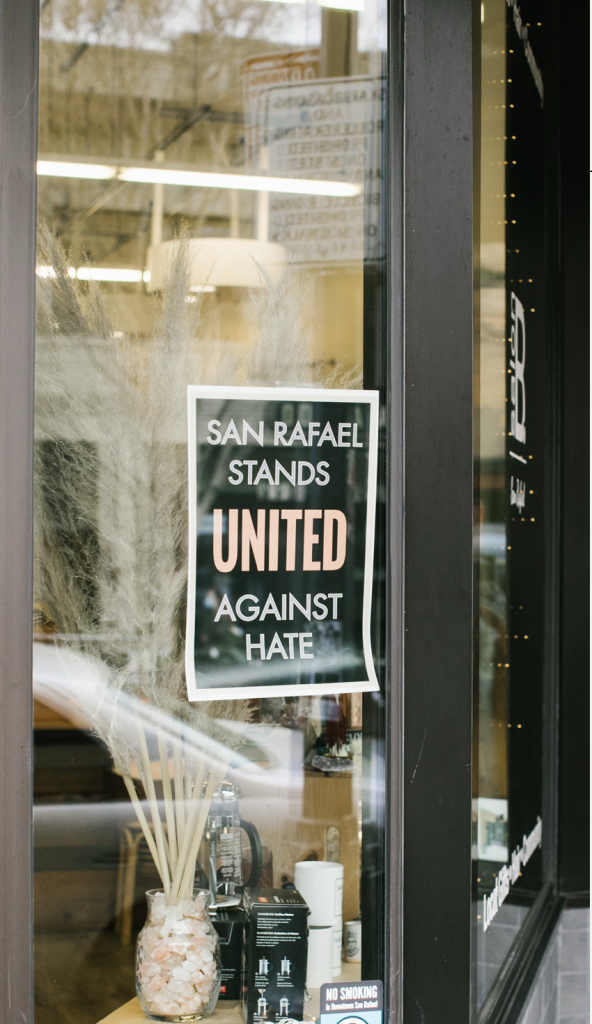 United Against Hate Poster on window